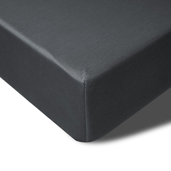 A close up of a charcoal fitted sheet of Accesorize Bamboo Cotton, offering temperature control and a generous fit for high-top mattresses.