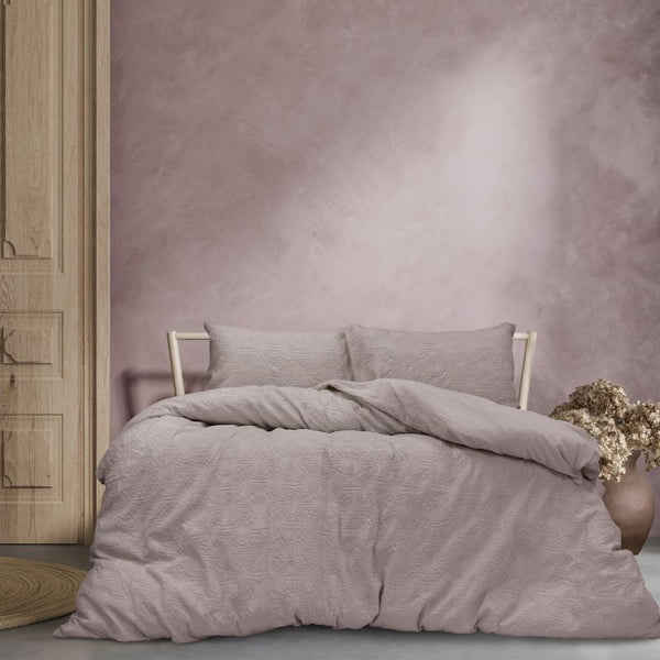 A cosy mauve quilt cover set featuring a subtle geometric embossed pattern.