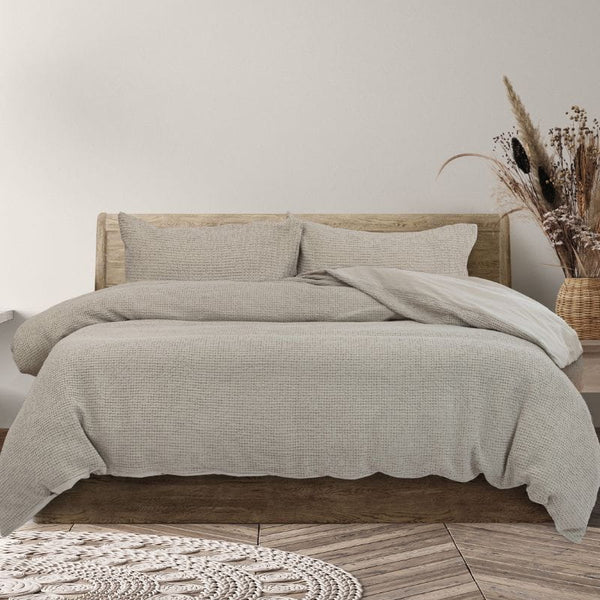 Experience of the cosy charm of the natural quilt cover set featuring a vintage cotton design with textured waffle for added depth and warmth.