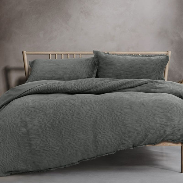 A stylish grey quilt cover set with crinkled textures and vintage frayed edges, perfect for winter bedding.