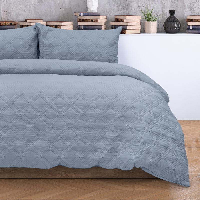  Stylish blue quilt cover with a chic geometric design, adding a touch of elegance to your serene bedroom retreat.