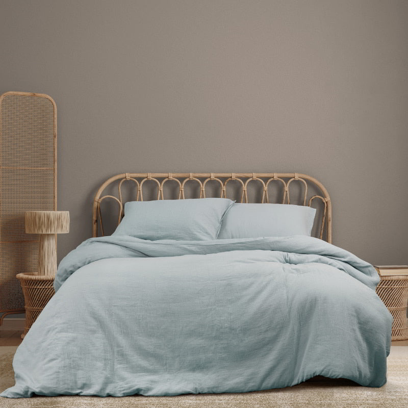 Stylish bed with a blue quilt cover, bringing a peaceful touch to your bedroom sanctuary.