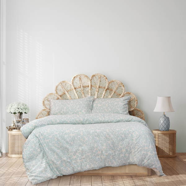 A stylish bed highlighting the floral design of the Isla Quilt Cover Set.