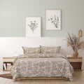 A peaceful bedroom scene with a green wall, featuring the exquisite Jasmine Quilt Cover Set for serene comfort.