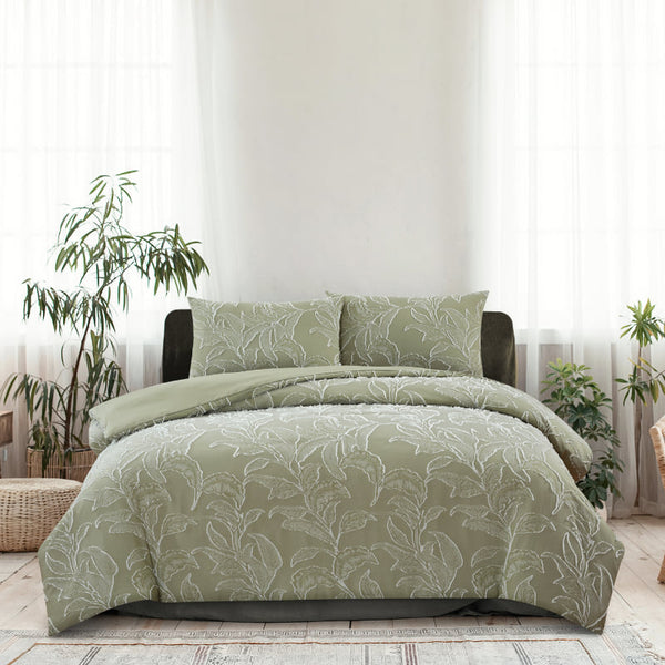 alt="A pale olive quilt cover set features a beautifully textural tropical design front with a plain dyed reverse."