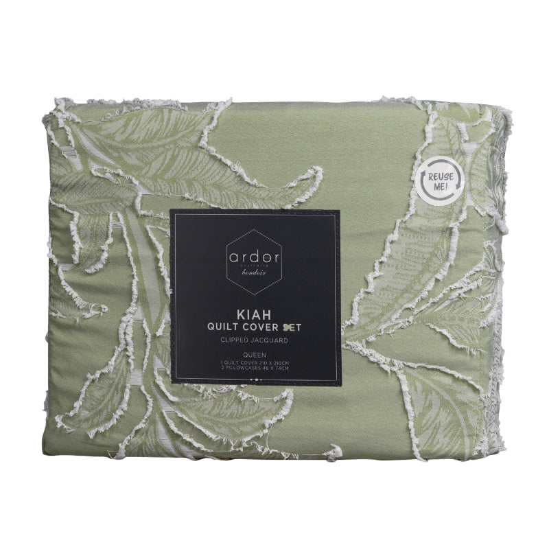 alt="Nice packaging of a pale olive quilt cover set features a beautifully textural tropical design front with a plain dyed reverse."