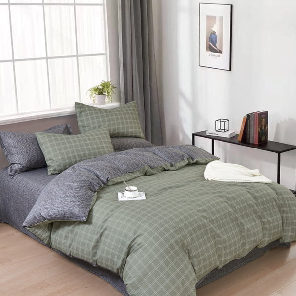 A cosy grey quilt cover set in a bedroom adding a touch of timeless elegance to the sleeping space.