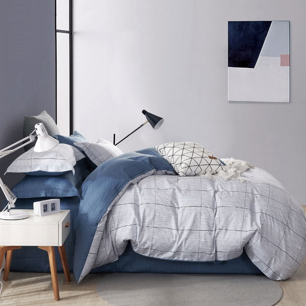 Cosy bedroom featuring an elegant Ardor Oakley multi quilt cover set in a classic striped design.