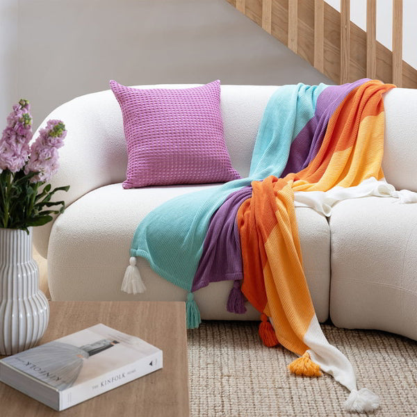 A vibrant Azalea Multi Throw, enhancing the cosy atmosphere near a staircase.