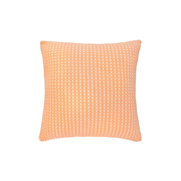 A stylish orange and white checkered pillow, enhancing decor with its rich waffle fabric and soft, durable cotton yarn.