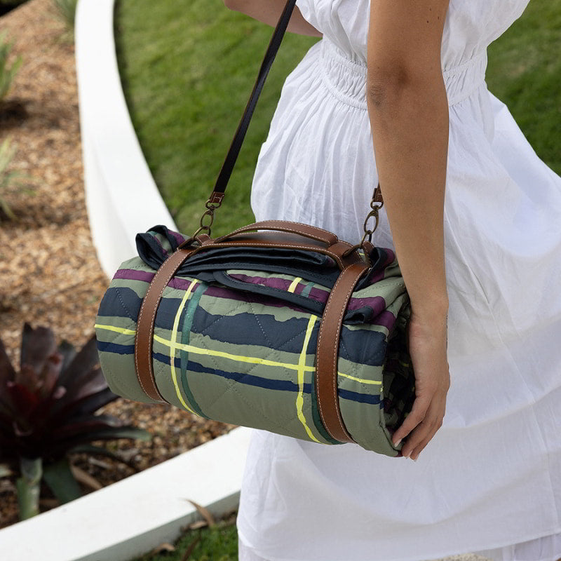 A woman in a white dress, ready for an outdoor picnic with the Bambury Felix Picnic Rug