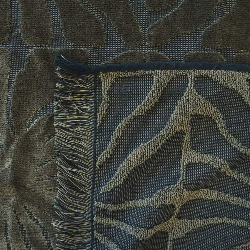 A close-up view of the HiLo Dandy Khaki Beach Towel showcasing its intricate texture and elegant design.