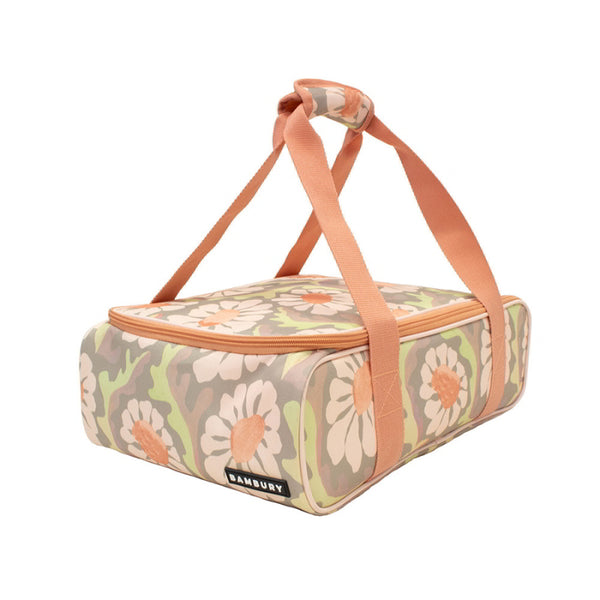 A floral Sadie orange food carrier, designed for transporting meals while keeping them warm or chilled.