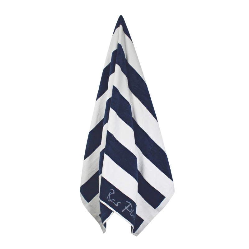 Hanging details of Cabana navy beach towel showcasing a soft and absorbent cotton that is ideal for seaside relaxation.