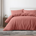 Luxurious quilt cover set in a pink hues feature textured waffle.