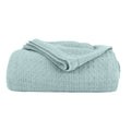 A blue cotton blanket featuring its luxuriously soft and resilient Cotton with added polyester.