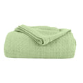 A green Cotton Blanket featuring its luxuriously soft and resilient Cotton with added polyester.