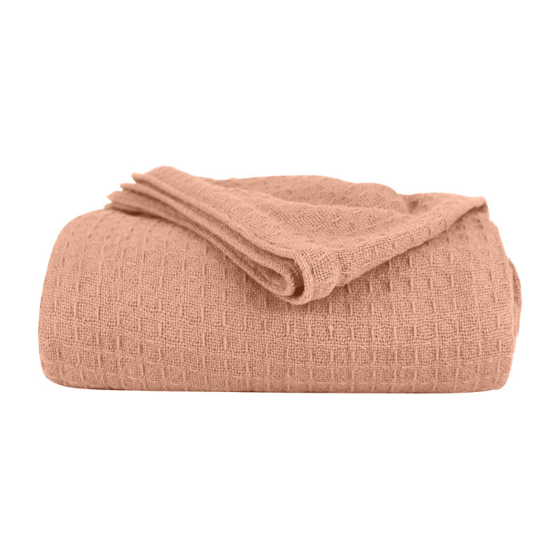 A peach Cotton Blanket featuring its luxuriously soft and resilient Cotton with added polyester.