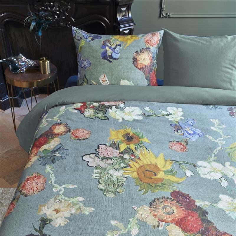 alt="Close-up look of a quilt cover set inspired by Van Gogh Museum's 50th-anniversary bouquet, featuring a floral pattern on a green background."