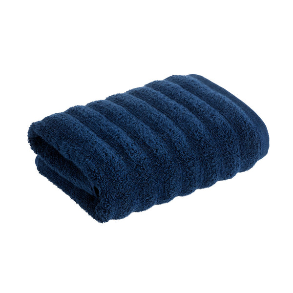 Experience the plush luxury of the Christy Kensington Navy Hand Towel, designed from 100% cotton for superior absorbency and style.