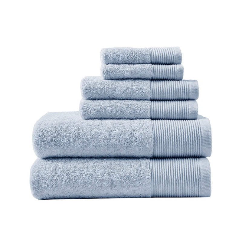 A stack of luxurious blue towels made from eco-friendly Tencel and cotton, promoting sustainability and advanced hygiene.