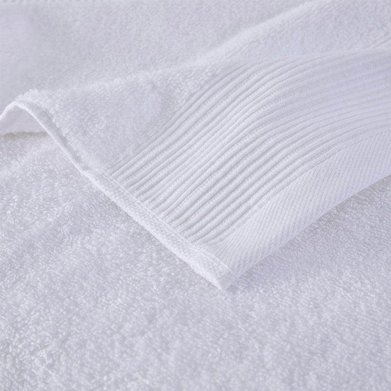 Zoom in details of a luxurious white towels made from eco-friendly Tencel and cotton, promoting sustainability and advanced hygiene.