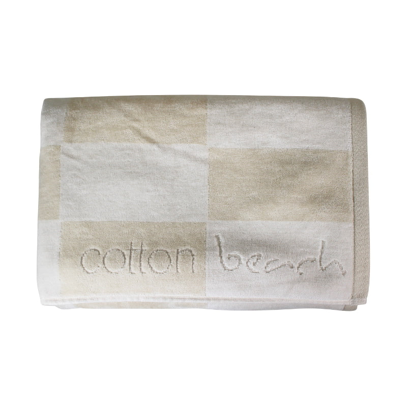 Close up details of a calming beach checkerboard design towel, ideal for a tranquil beach day experience.