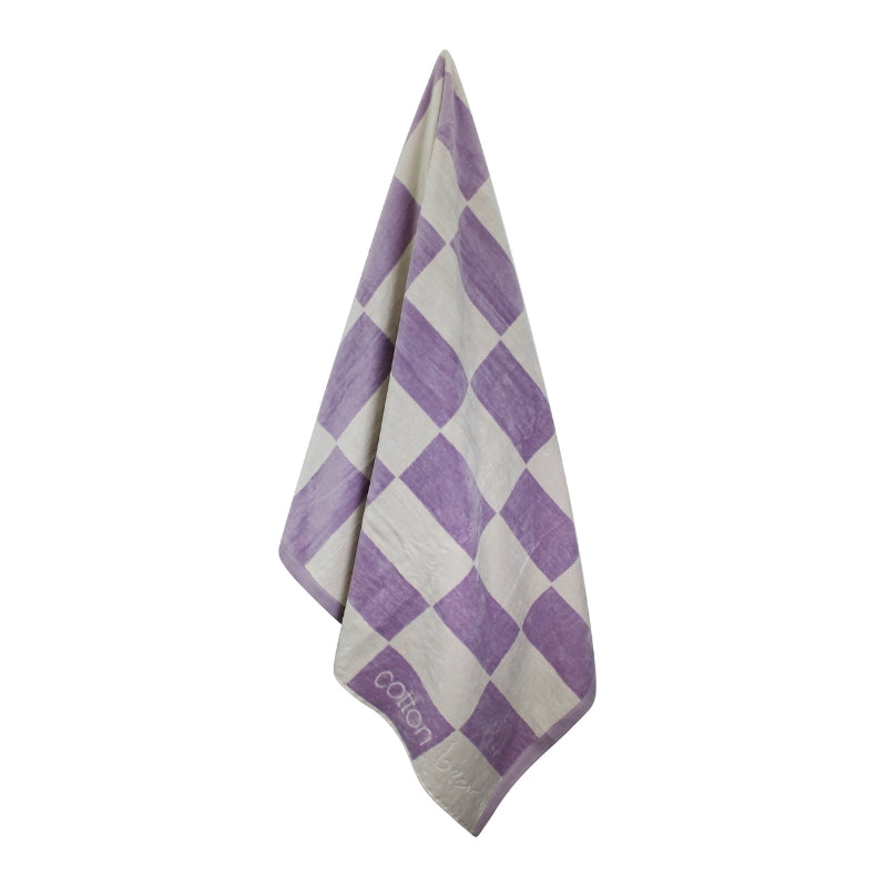 Hanging details of a calming lavender checkerboard design towel, ideal for a tranquil beach day experience.