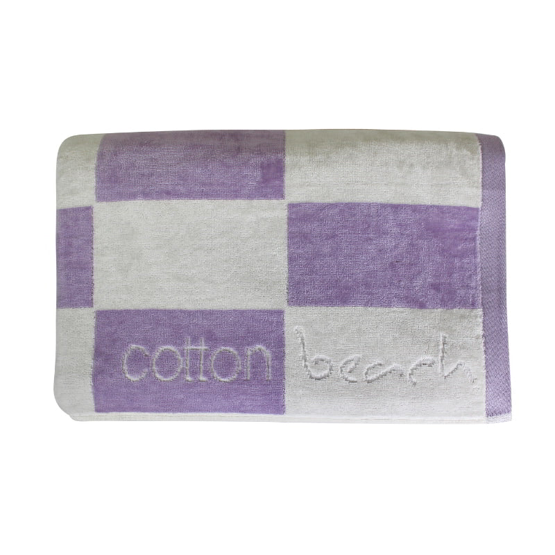 Close up details of a calming lavender checkerboard design towel, ideal for a tranquil beach day experience.