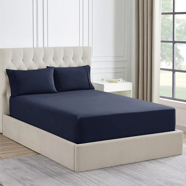 Luxurious Ddecor Home 1500 Thread Count Indigo Fitted Sheet and Pillowcase Set, combining cotton and polyester for comfort and easy care to your bedroom.