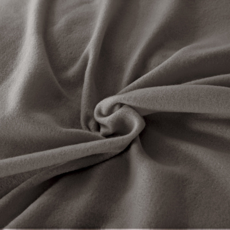 Close up details of a luxuriously charcoal premium microflannel for a cosy haven in your bedroom.