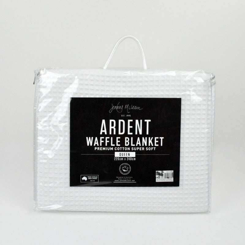 Detailed packaging of a white blanket, showcasing a minimalist aesthetic and a sense of tranquility.