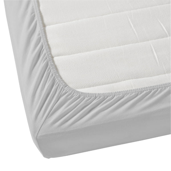 Detailed view of a mattress  featuring the soft and smooth Jenny Mclean La Via Fitted Sheet in Silver.