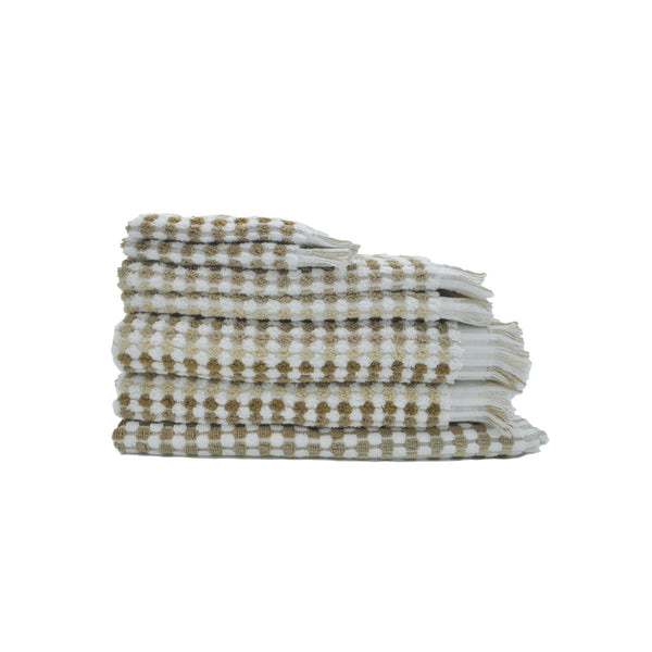 A neatly arranged stack of towels with a natural and white checker design, offering a blend of style and comfort for your bathroom.