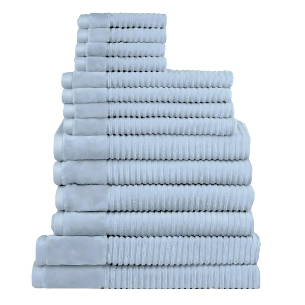 Fourteen plush blue towels arranged in a stack, highlighting their softness and absorbency, ideal for enhancing daily rituals.