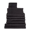 Fourteen plush black towels arranged in a stack, highlighting their softness and absorbency, ideal for enhancing daily rituals.