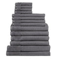 Fourteen plush charcoal towels arranged in a stack, highlighting their softness and absorbency, ideal for enhancing daily rituals.