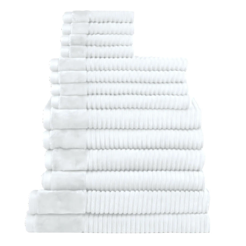 Fourteen plush white towels arranged in a stack, highlighting their softness and absorbency, ideal for enhancing daily rituals.