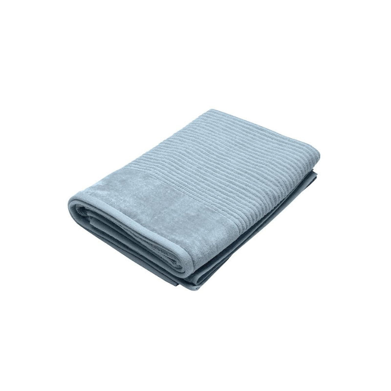 A baby blue bath sheet elegantly displayed on a white background, showcasing its softness and high-quality cotton fabric.