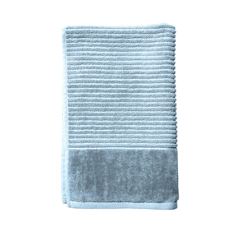 A baby blue hand towel elegantly folded against a white backdrop, emphasizing its softness and stylish appeal for a cosy bathroom vibe.