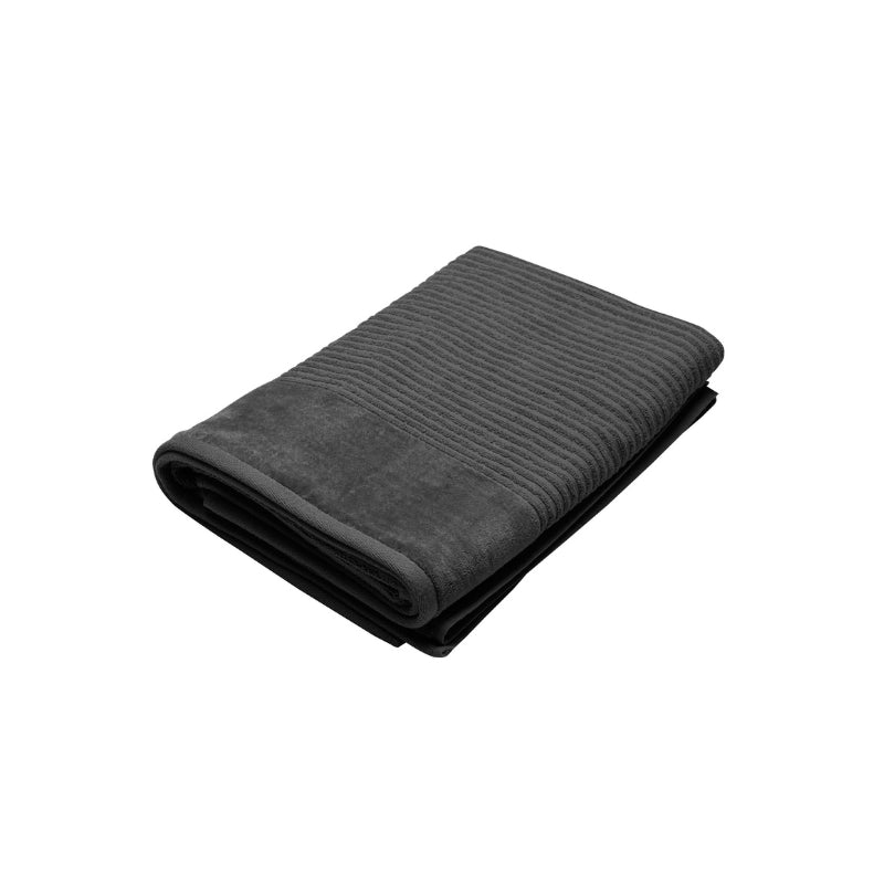 A sleek charcoal bath sheet on a white surface, emphasizing its comfort and fade-resistant qualities for everyday use.