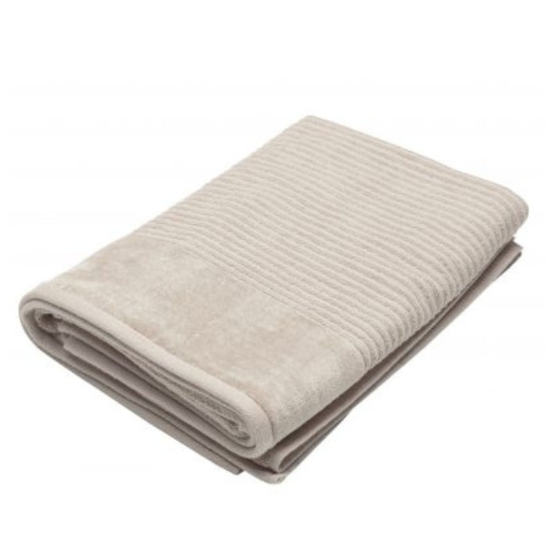 A neatly folded light beige towel from the Jenny Mclean Royal Excellency collection, showcasing luxury and softness.