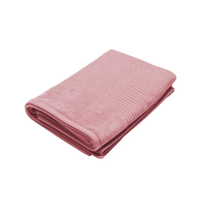 A rosebud bath sheet elegantly displayed on a white background, showcasing its softness and high-quality cotton fabric.