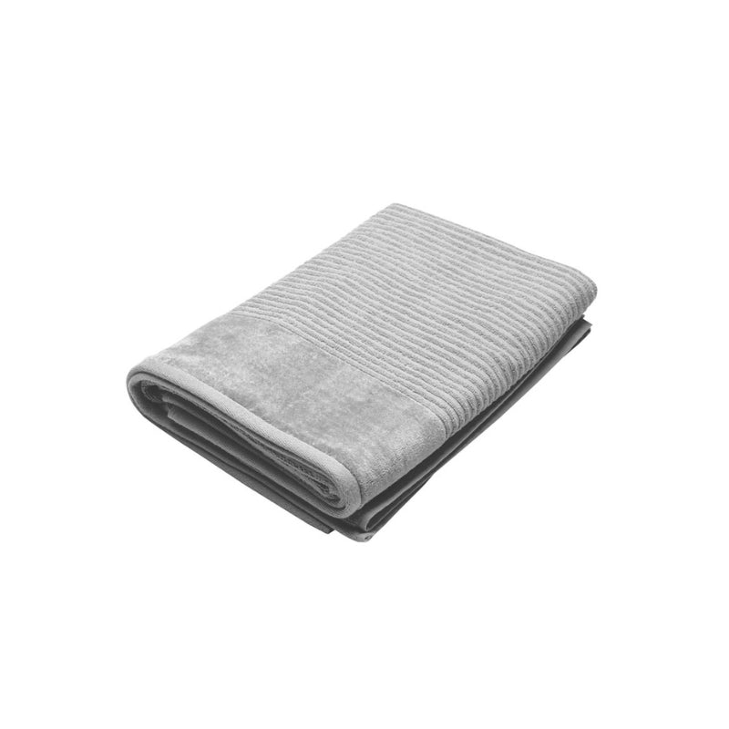 A sleek silver bath sheet on a white surface, emphasizing its comfort and fade-resistant qualities for everyday use.