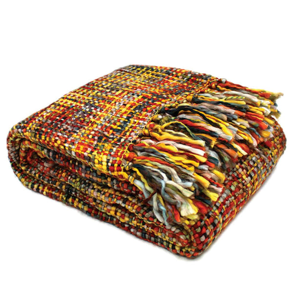 A vibrant throw featuring multicoloured fringes, perfect for summer adventures and cosy days at home.