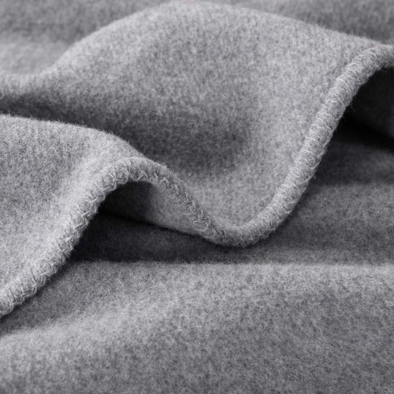 The grey blanket of Laconia offers durability, warmth, and comfort for all seasons.