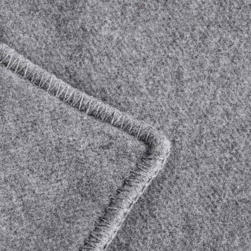 Close up detail of the grey blanket of Laconia that is made from premium Australian pure new wool.