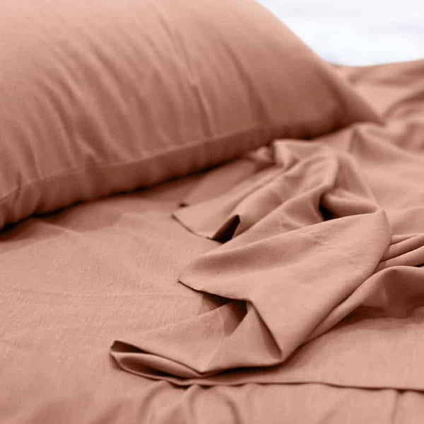 A luxuriously soft to touch bamboo and polyester blend sheet set in clay.