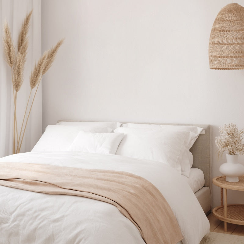 Serene white bedroom with a comfortable bed, showcasing the Odyssey Living Bamboo Blend White Quilt Cover Set.