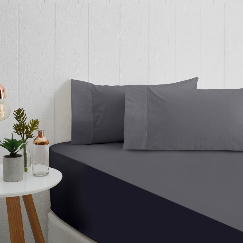 A stunning charcoal breathe cotton fitted sheet in a bedroom setup.